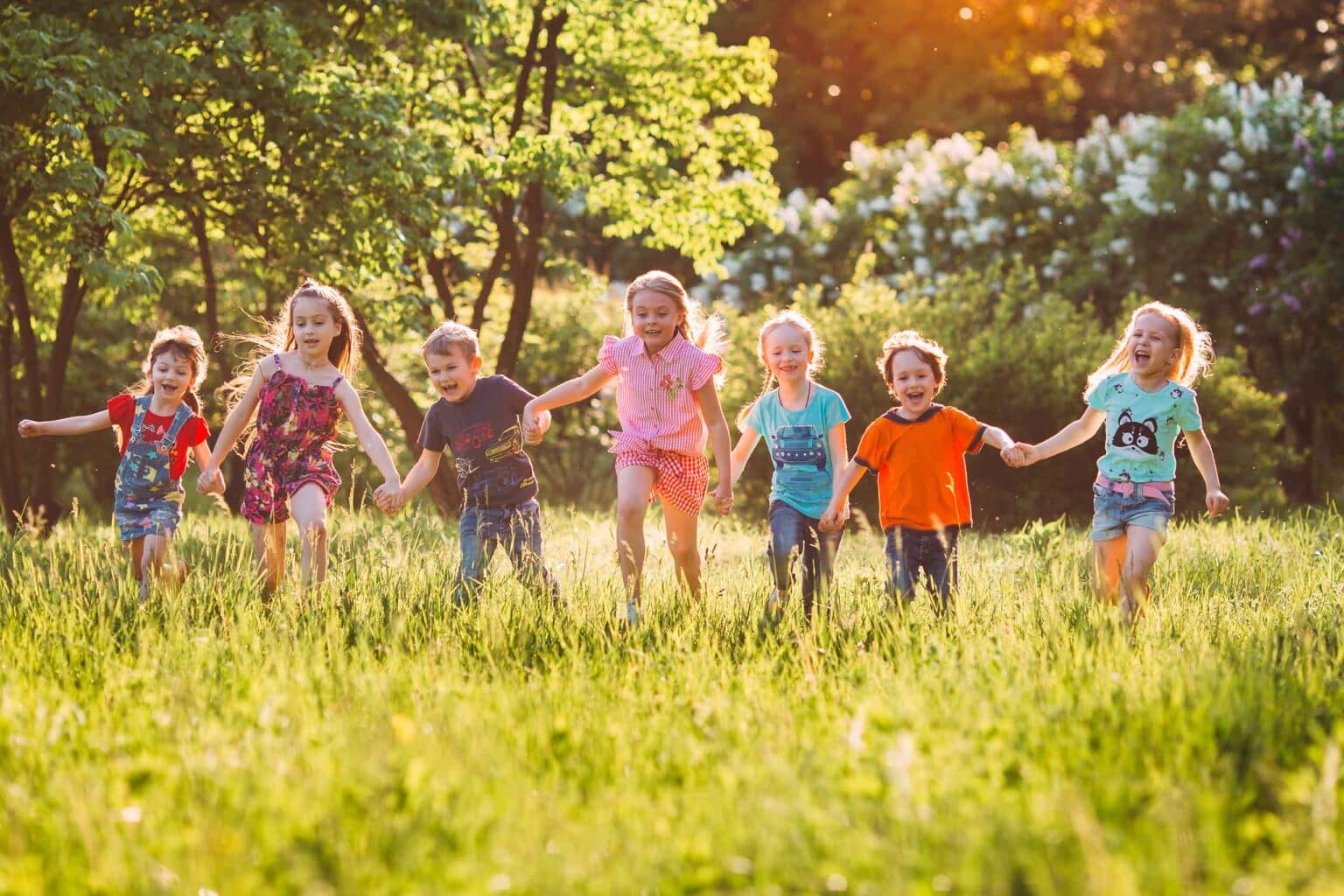 Children Running Through a Meadow